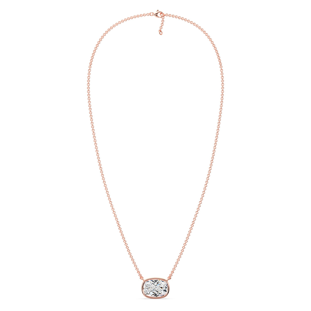 A beautiful 2 Carat Cushion-Cut Lab-Grown Diamond Bezel-Set Solitaire Pendant Necklace in 18K Rose Gold. The romantic pinkish tone enhances the sparkle of the IGI-certified diamond, making it a perfect blend of charm and sophistication.