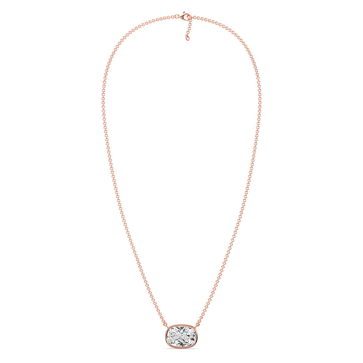 A beautiful 2 Carat Cushion-Cut Lab-Grown Diamond Bezel-Set Solitaire Pendant Necklace in 18K Rose Gold. The romantic pinkish tone enhances the sparkle of the IGI-certified diamond, making it a perfect blend of charm and sophistication.