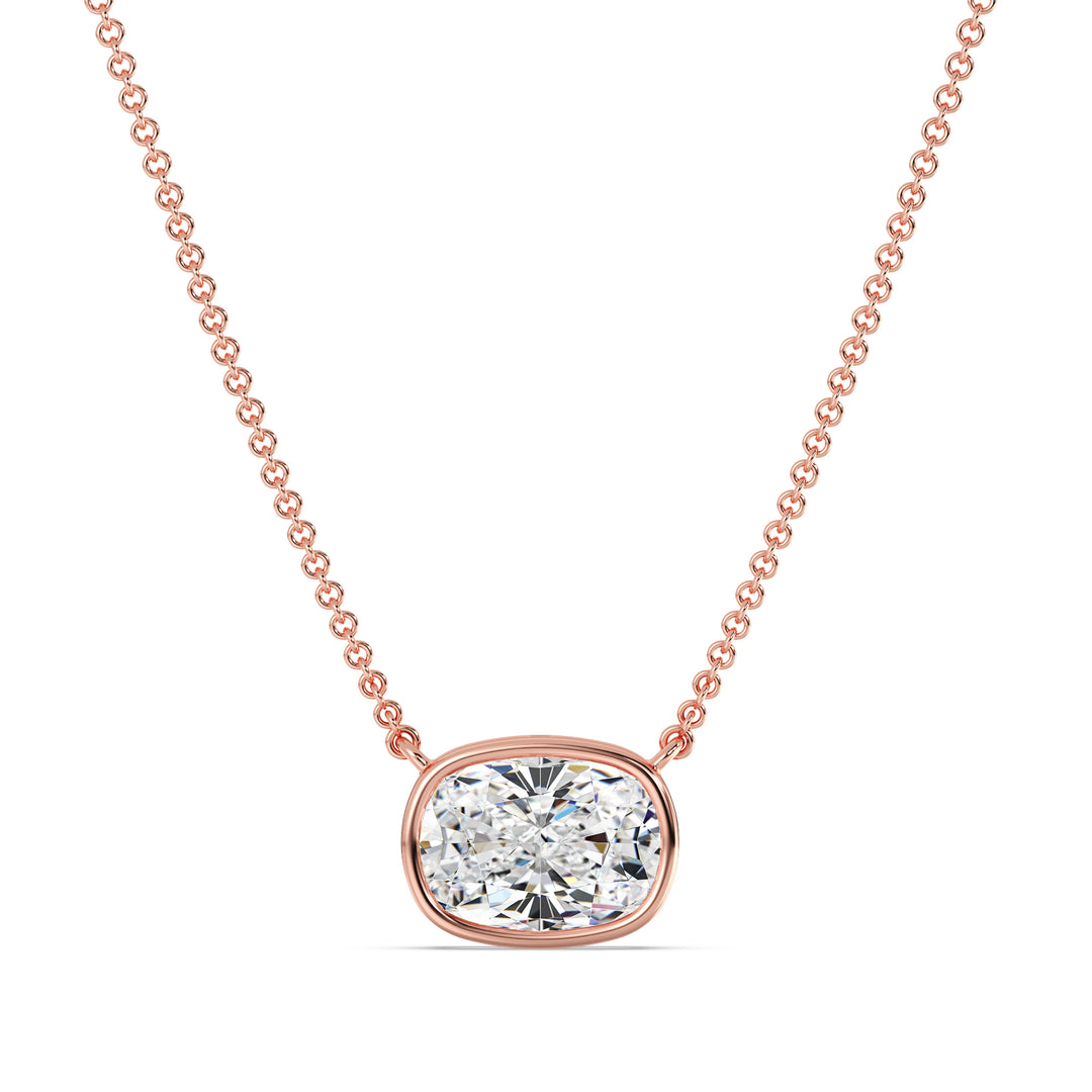 A beautiful 2 Carat Cushion-Cut Lab-Grown Diamond Bezel-Set Solitaire Pendant Necklace in 18K Rose Gold. The romantic pinkish tone enhances the sparkle of the IGI-certified diamond, making it a perfect blend of charm and sophistication.