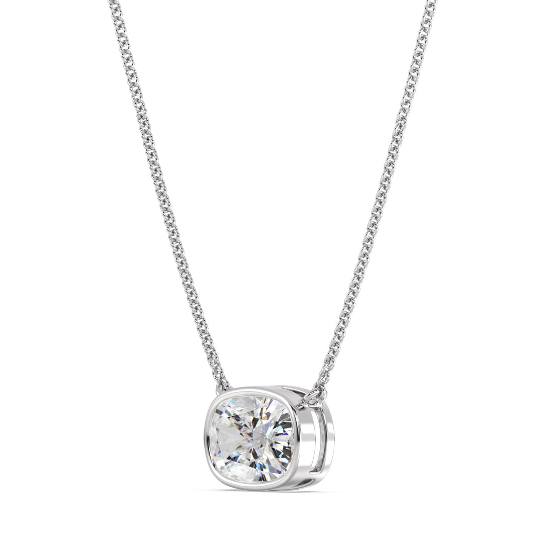 An elegant 2 Carat Cushion-Cut Lab-Grown Diamond Bezel-Set Solitaire Pendant Necklace in 18K White Gold. The modern and sleek white metal setting accentuates the brilliance of the IGI-certified diamond, offering a refined and contemporary look.