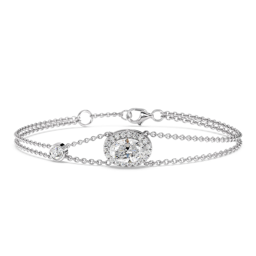 Double Chain 18K White Gold Bracelet with a 1ct Oval-Cut Lab-Grown Diamond in a halo setting, accented by 20 Round-Cut EF/VS Lab-Grown Diamonds for a sleek and timeless design.
