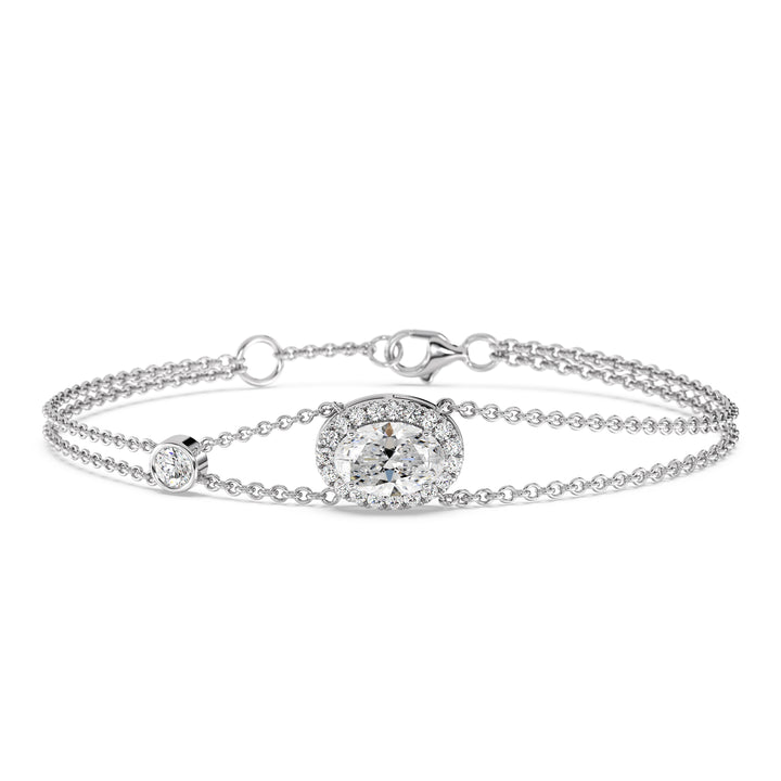 Double Chain 18K White Gold Bracelet with a 1ct Oval-Cut Lab-Grown Diamond in a halo setting, accented by 20 Round-Cut EF/VS Lab-Grown Diamonds for a sleek and timeless design.