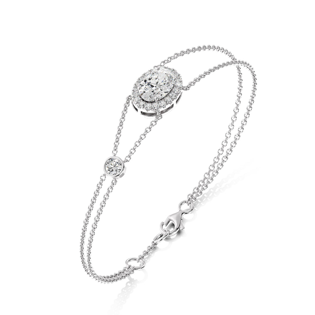 Double Chain 18K White Gold Bracelet with a 1ct Oval-Cut Lab-Grown Diamond in a halo setting, accented by 20 Round-Cut EF/VS Lab-Grown Diamonds for a sleek and timeless design.