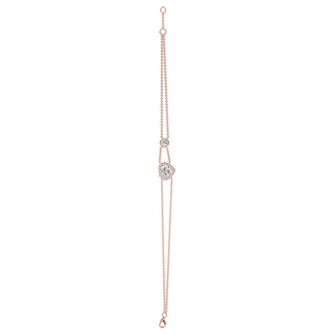 Double-chain bracelet in 18K rose gold with a 1ct heart-cut lab-grown diamond encircled by a halo of 19 round EF/VS lab-grown diamonds, exuding warmth and modern sophistication