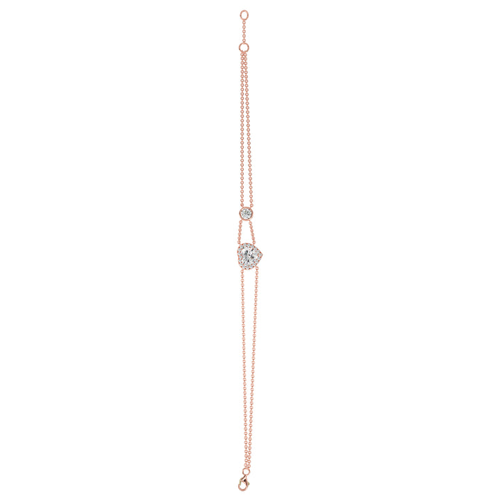 Double-chain bracelet in 18K rose gold with a 1ct heart-cut lab-grown diamond encircled by a halo of 19 round EF/VS lab-grown diamonds, exuding warmth and modern sophistication