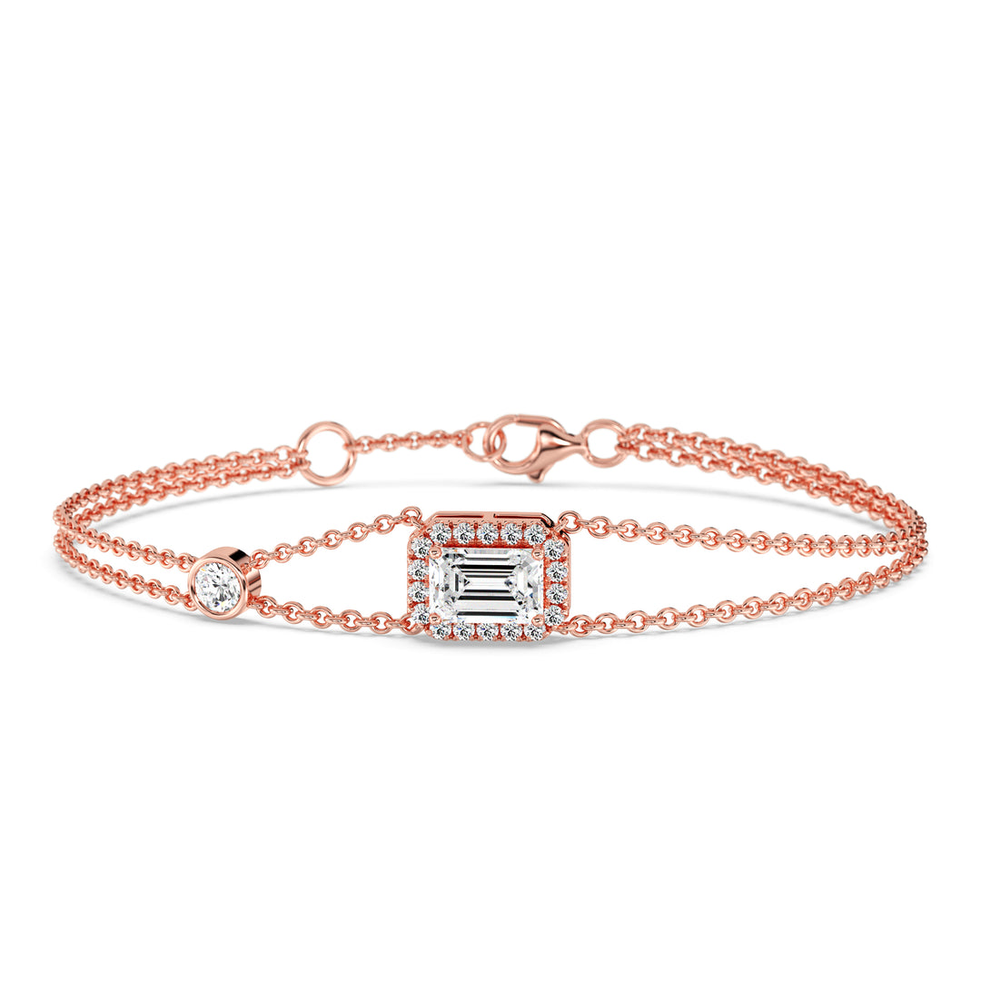 Sophisticated double-chain bracelet in 18K rose gold, showcasing a 1ct emerald-cut lab-grown diamond encircled by a halo of 19 round EF/VS lab-grown diamonds