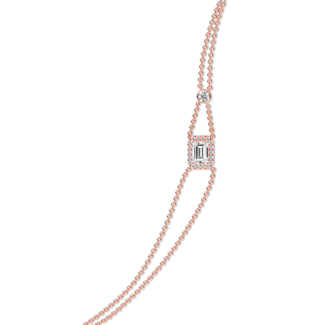 Sophisticated double-chain bracelet in 18K rose gold, showcasing a 1ct emerald-cut lab-grown diamond encircled by a halo of 19 round EF/VS lab-grown diamonds