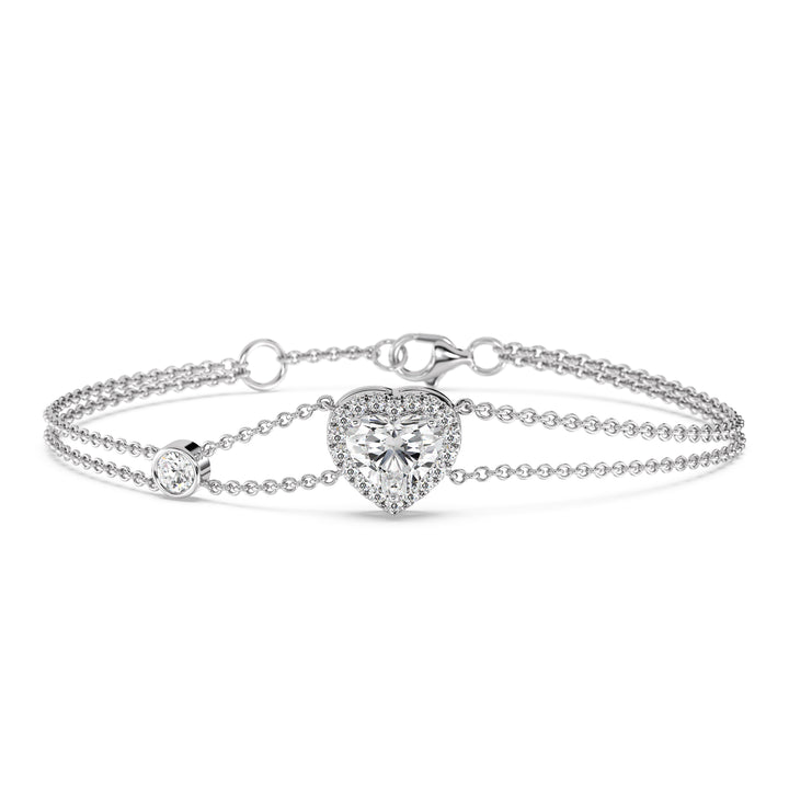 Double-chain bracelet in 18K white gold featuring a 1ct heart-cut lab-grown diamond in a shimmering halo of 19 round EF/VS lab-grown diamonds, offering a sleek and classic look.