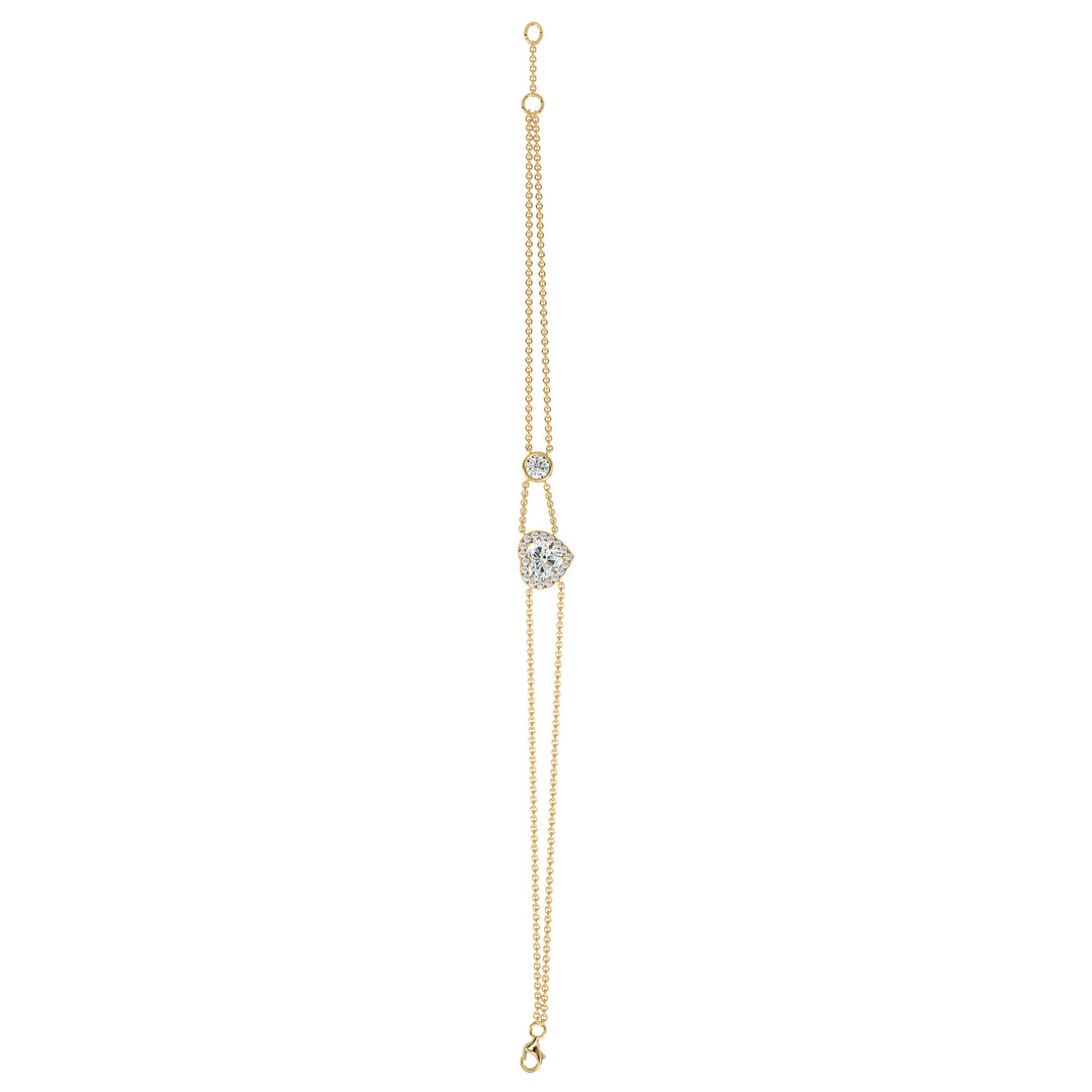 Double-chain bracelet in 18K yellow gold featuring a 1ct heart-cut lab-grown diamond surrounded by a halo of 19 round EF/VS lab-grown diamonds, showcasing timeless elegance and radiant sparkle