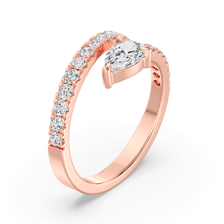 Stylish pear-shaped lab-grown diamond adjustable open cuff ring in 18K rose gold featuring a 0.50-carat pear-shaped diamond and round-cut diamond accents