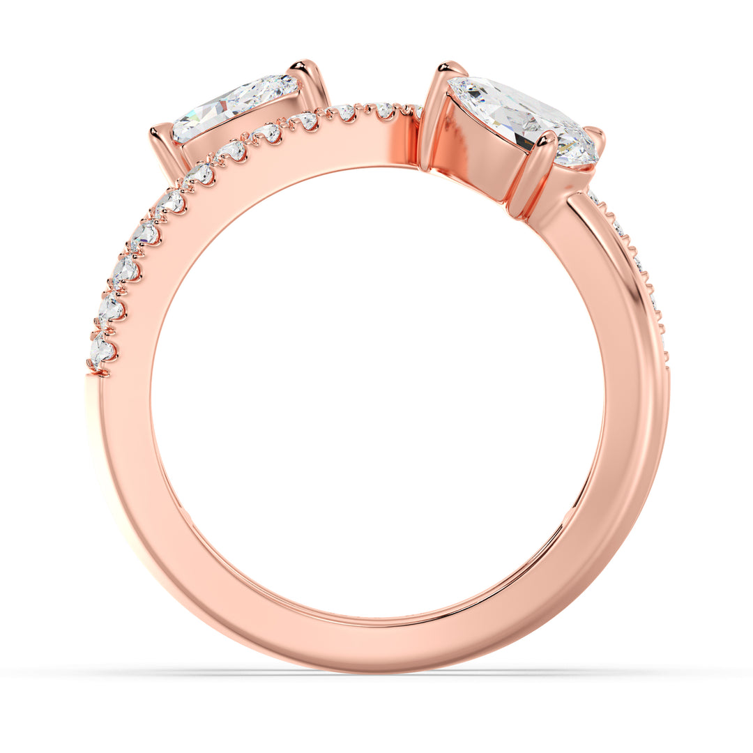 Elegant Pear-Shaped Lab-Grown Diamond Dual-Stone Twisted Ring in 18K Rose Gold, showcasing two 0.50-carat pear-cut diamonds and 21 sparkling round-cut side stones.