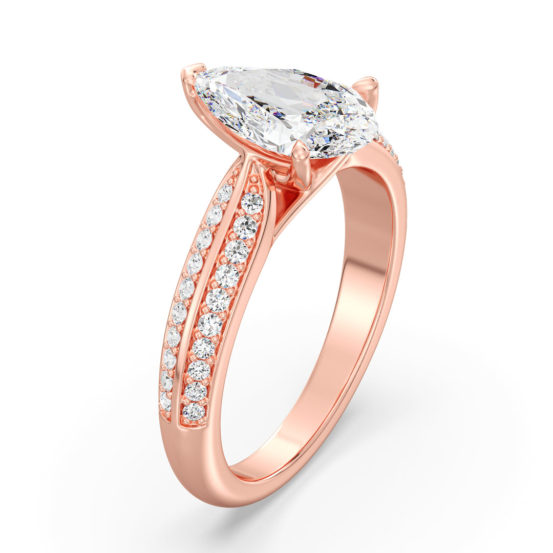 Elegant pear-cut lab-grown diamond engagement ring with pavé band in 18K rose gold, showcasing a dazzling pear-cut center stone and sparkling round lab-grown diamonds