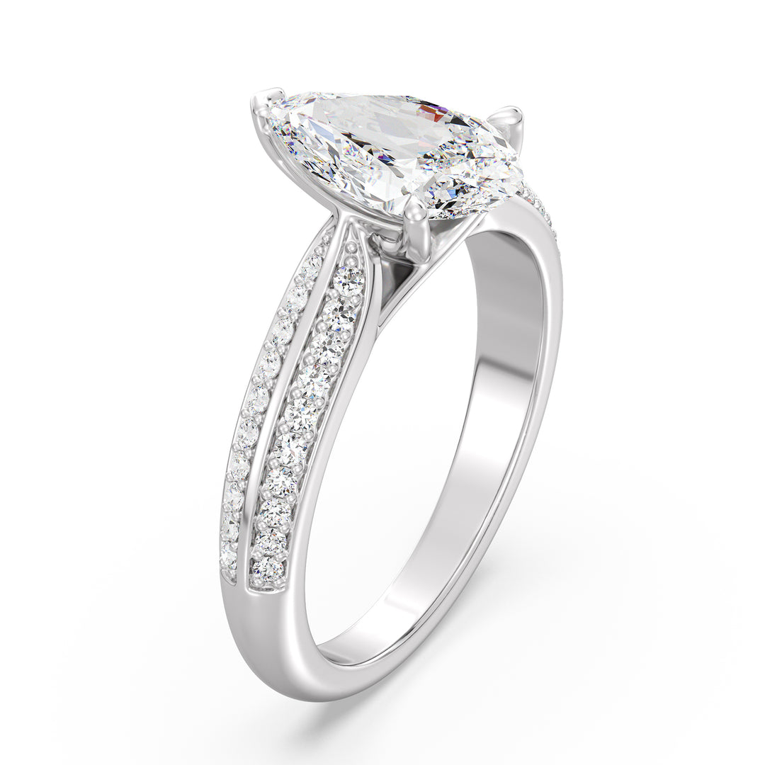 Elegant pear-cut lab-grown diamond engagement ring with pavé band in 18K white gold, highlighted by a stunning pear-cut center stone and shimmering round lab-grown diamonds.