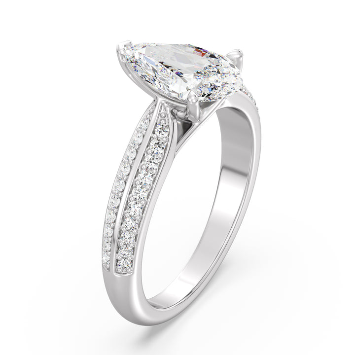 Elegant pear-cut lab-grown diamond engagement ring with pavé band in 18K white gold, highlighted by a stunning pear-cut center stone and shimmering round lab-grown diamonds.