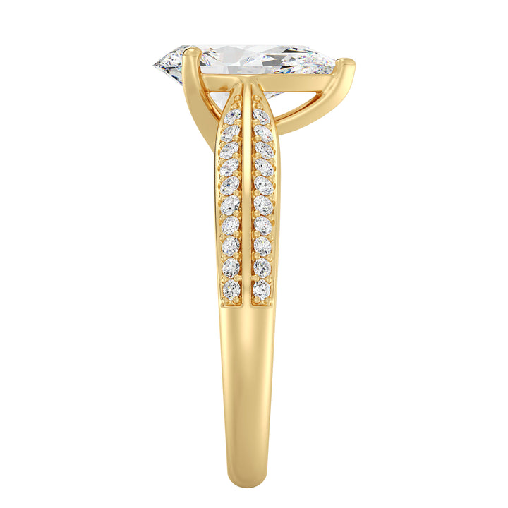 Elegant pear-cut lab-grown diamond engagement ring with pavé band in 18K yellow gold, featuring a brilliant pear-cut center stone and round lab-grown diamonds.