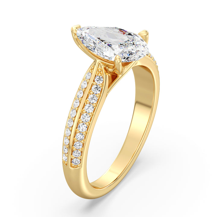 Elegant pear-cut lab-grown diamond engagement ring with pavé band in 18K yellow gold, featuring a brilliant pear-cut center stone and round lab-grown diamonds.