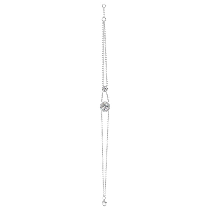 Image of the Halo-Set Round Lab-Grown Diamond Double Chain Bracelet in 18K White Gold, highlighting a 1ct round-cut lab-grown diamond framed by a halo of 19 smaller diamonds, paired with an elegant double-chain design.