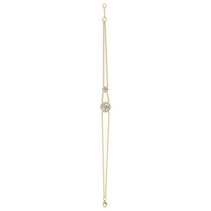 Image of the Halo-Set Round Lab-Grown Diamond Double Chain Bracelet in 18K Yellow Gold, featuring a 1ct round-cut lab-grown diamond surrounded by a halo of 19 smaller diamonds, with a unique double-chain design