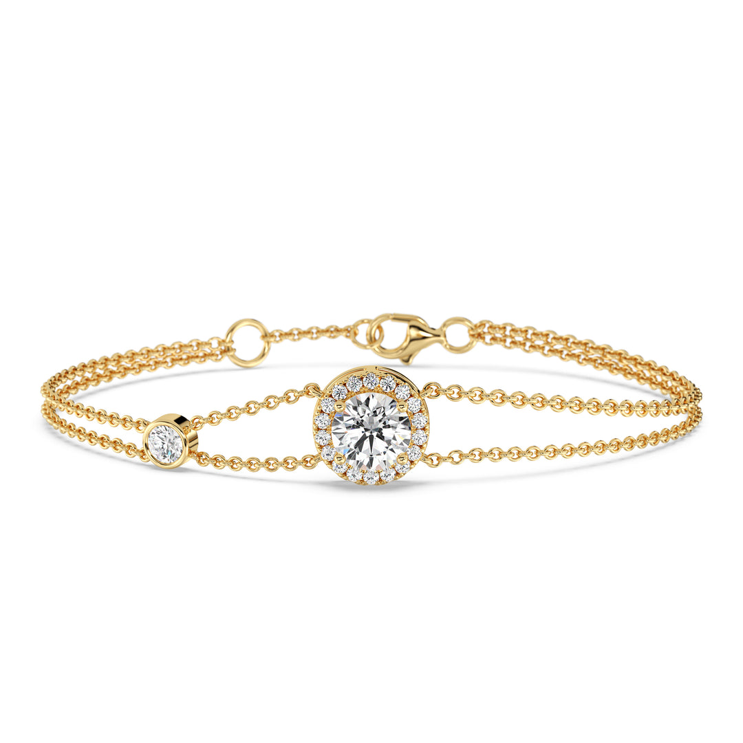 Image of the Halo-Set Round Lab-Grown Diamond Double Chain Bracelet in 18K Yellow Gold, featuring a 1ct round-cut lab-grown diamond surrounded by a halo of 19 smaller diamonds, with a unique double-chain design
