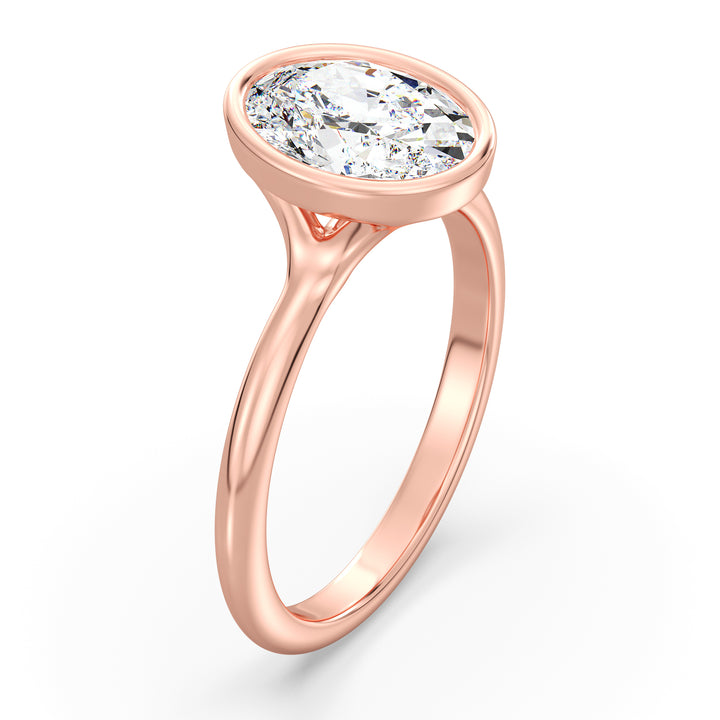 Oval-Cut Lab-Grown Diamond Solitaire Ring in 18K Rose Gold with Bezel Setting, Available in 1ct, 2ct, 3ct, or 4ct.