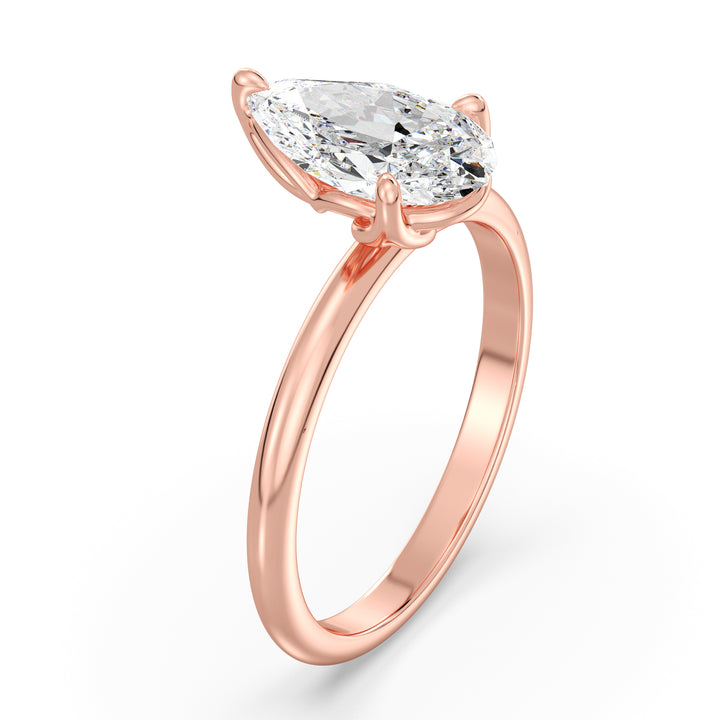 Elegant Pear-Cut Lab Diamond Solitaire Engagement Ring in 18K Rose Gold, showcasing a stunning EF color VS clarity lab-grown diamond in an open basket setting.