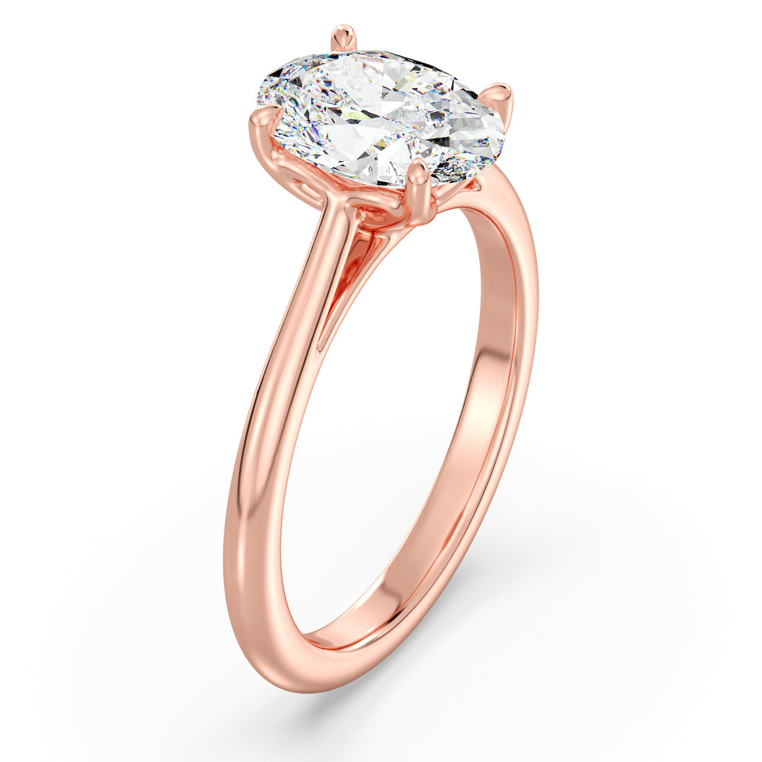 Elegant Oval-Cut Lab-Grown Diamond Solitaire Engagement Ring in 18K Rose Gold with Classic 4-Claw Setting, featuring a romantic blush-tone metal and a sparkling oval diamond.