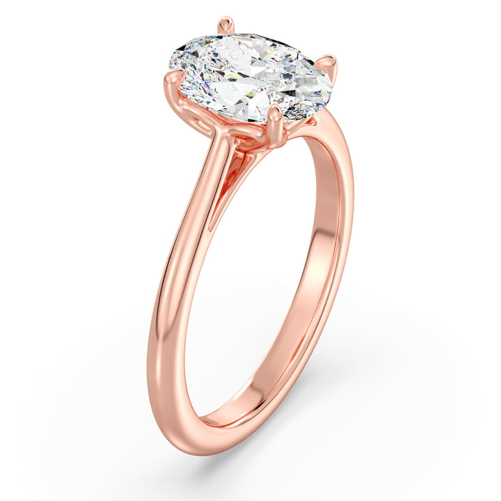 Elegant Oval-Cut Lab-Grown Diamond Solitaire Engagement Ring in 18K Rose Gold with Classic 4-Claw Setting, featuring a romantic blush-tone metal and a sparkling oval diamond.