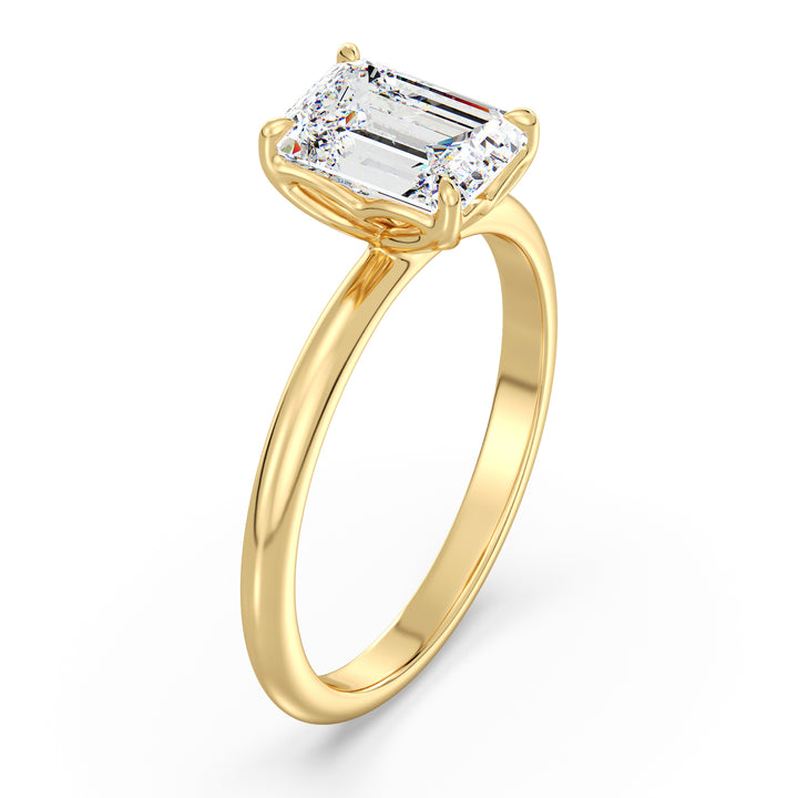 Classic emerald-cut solitaire engagement ring with a 4-claw lab-grown diamond in 18K yellow gold, showcasing timeless elegance and brilliance