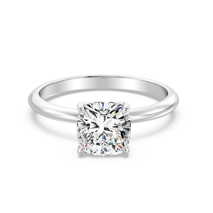 Timeless 4-Claw Cushion-Cut Lab-Grown Diamond Solitaire Engagement Ring in 18K White Gold with a sleek modern finish and a brilliant cushion-cut diamond.