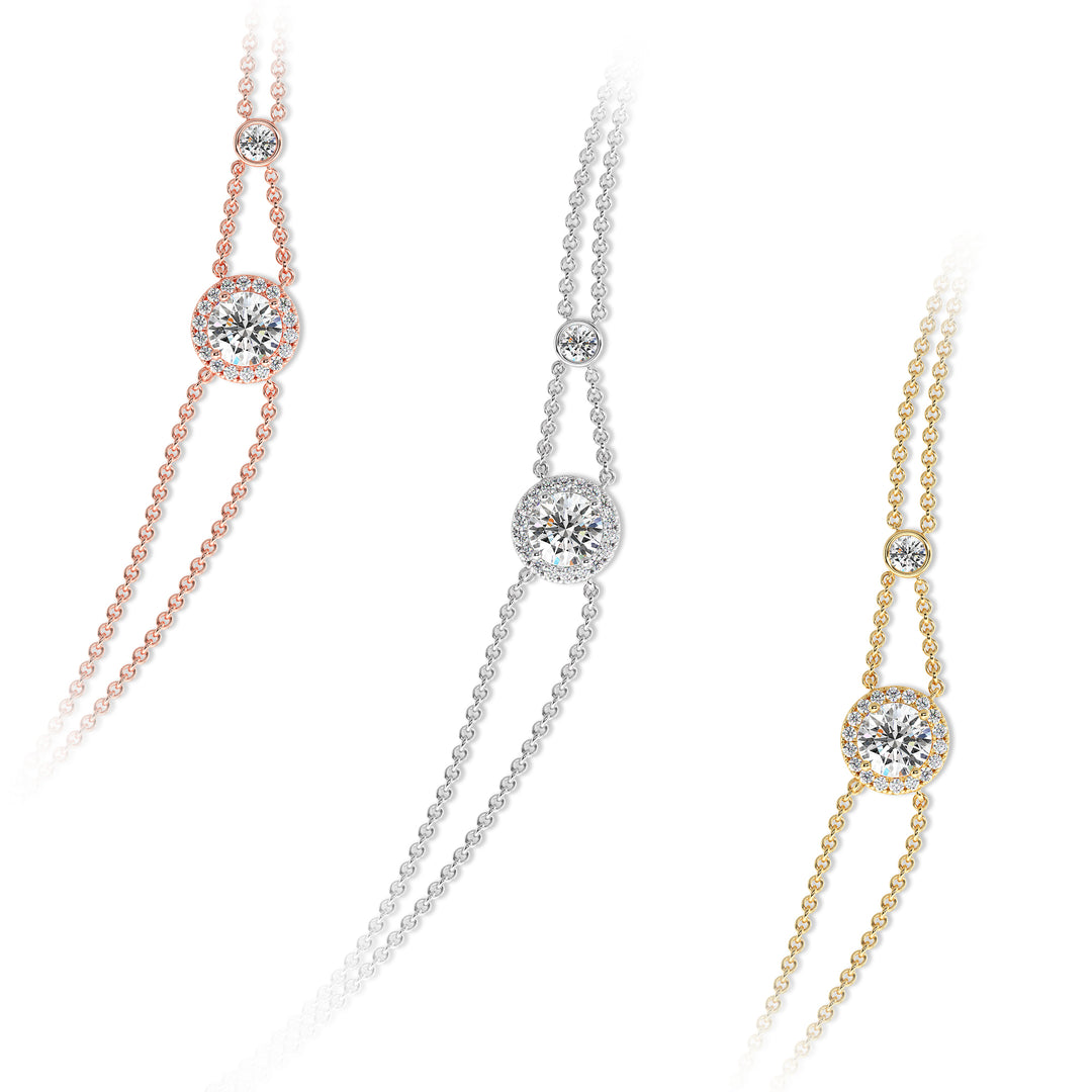Image of the Halo-Set Round Lab-Grown Diamond Double Chain Bracelet in 18K Gold, showcasing a 1ct round-cut lab-grown diamond encircled by a halo of 19 smaller diamonds, complemented by a modern double-chain design.