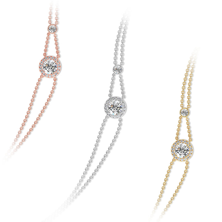 Image of the Halo-Set Round Lab-Grown Diamond Double Chain Bracelet in 18K Gold, showcasing a 1ct round-cut lab-grown diamond encircled by a halo of 19 smaller diamonds, complemented by a modern double-chain design.
