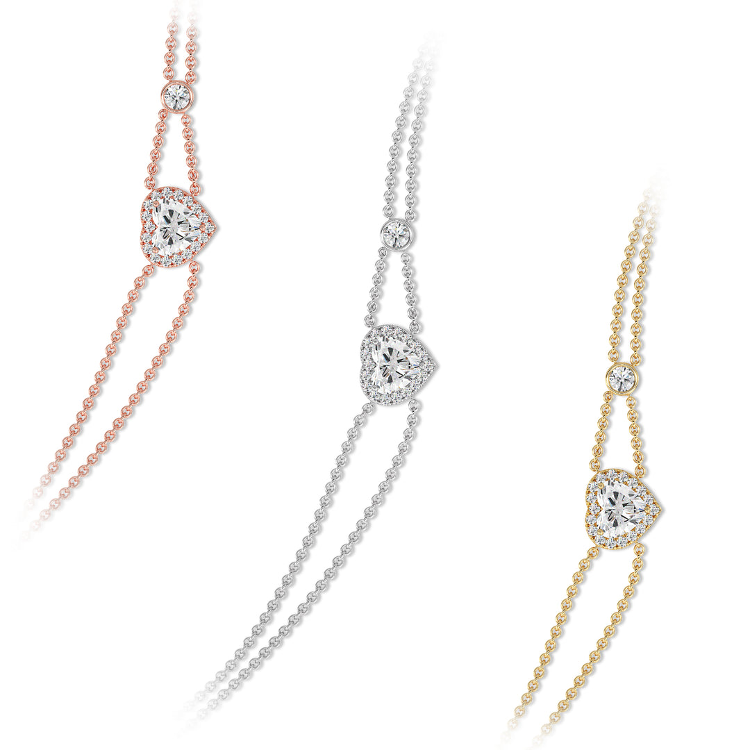 Double-chain bracelet in 18K gold with a 1ct heart-cut lab-grown diamond encircled by a halo of 19 round EF/VS lab-grown diamonds, exuding warmth and modern sophistication