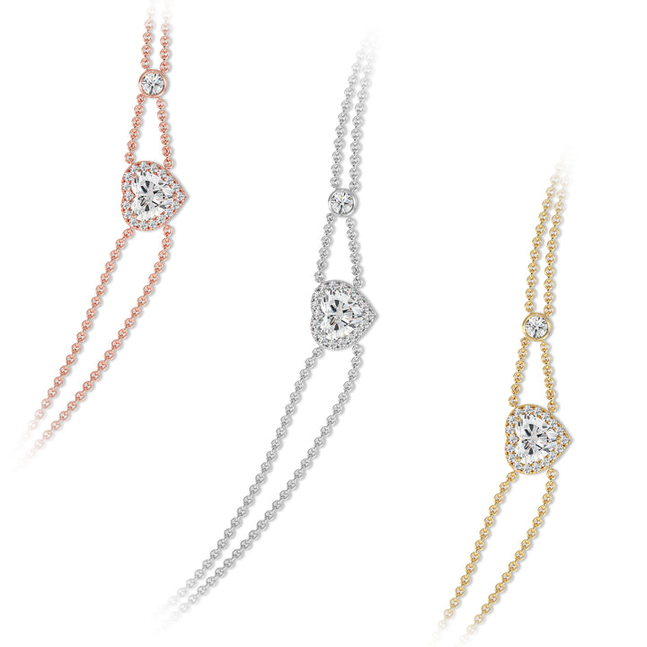 Double-chain bracelet in 18K gold with a 1ct heart-cut lab-grown diamond encircled by a halo of 19 round EF/VS lab-grown diamonds, exuding warmth and modern sophistication