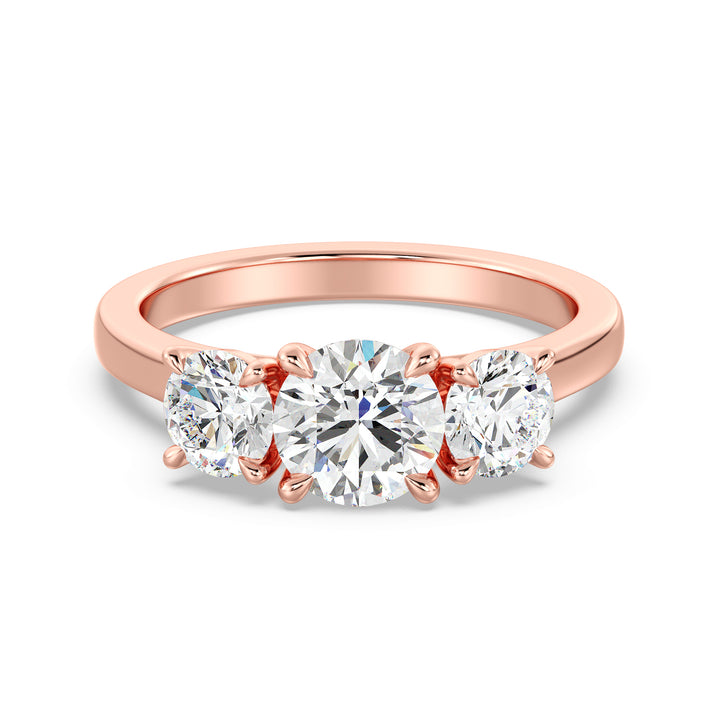 Three-Stone Round-Cut Lab-Grown Diamond Engagement Ring in 18K Rose Gold with Claw Prong Setting, showcasing a 1-carat center diamond and 0.50-carat side diamonds.