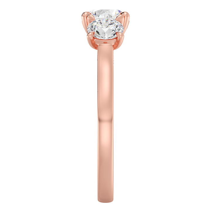 Three-Stone Round-Cut Lab-Grown Diamond Engagement Ring in 18K Rose Gold with Claw Prong Setting, showcasing a 1-carat center diamond and 0.50-carat side diamonds.