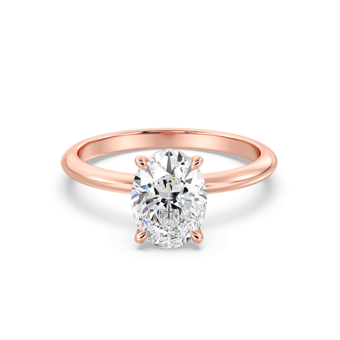 Timeless 4-Claw Oval Lab-Grown Diamond Solitaire Engagement Ring in 18K Rose Gold, showcasing a romantic hue paired with a stunning oval-cut diamond
