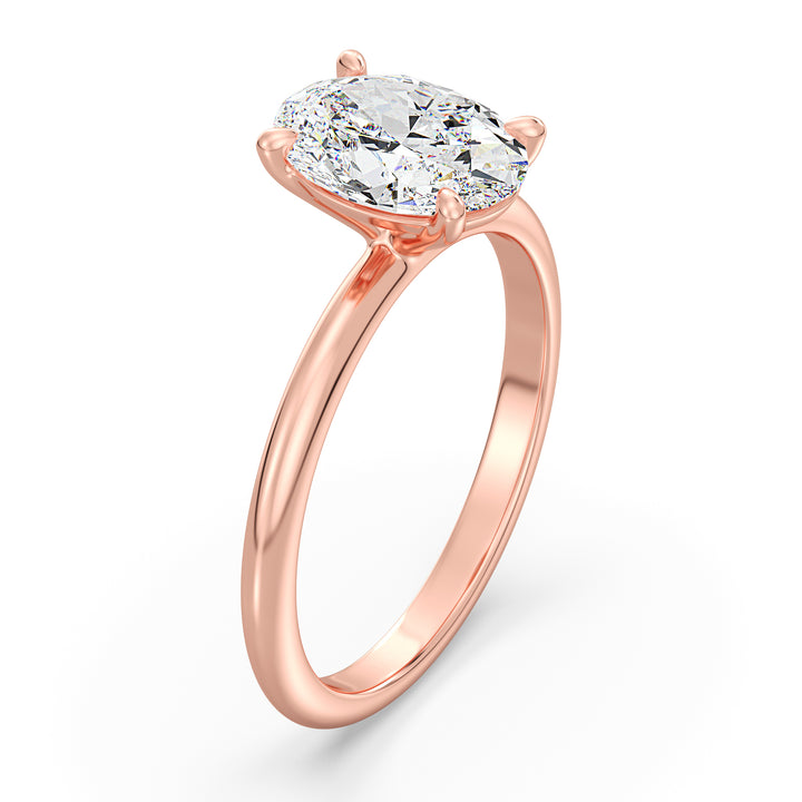 Timeless 4-Claw Oval Lab-Grown Diamond Solitaire Engagement Ring in 18K Rose Gold, showcasing a romantic hue paired with a stunning oval-cut diamond