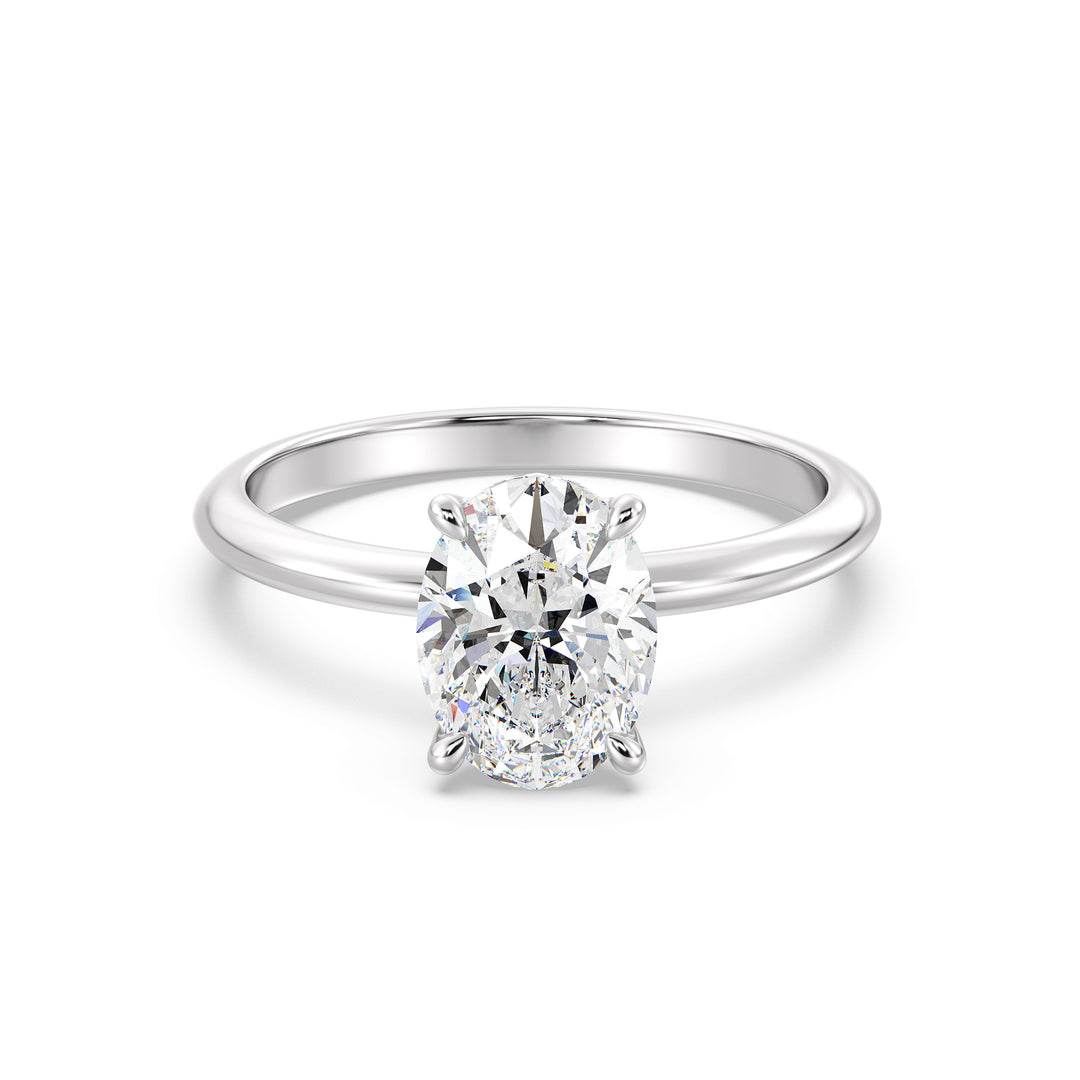 Timeless 4-Claw Oval Lab-Grown Diamond Solitaire Engagement Ring in 18K White Gold, highlighting a sleek and timeless design with a sparkling oval-cut diamond.