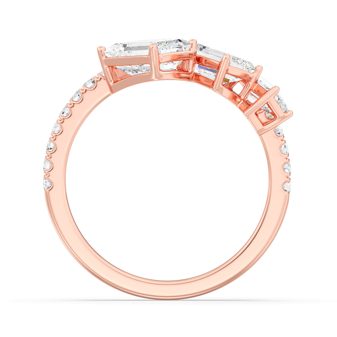Triple Emerald-Cut Lab-Grown Diamond Wedding Ring in 18K Rose Gold with three emerald-cut diamonds and pavé-set round diamonds, exuding romantic sophistication.