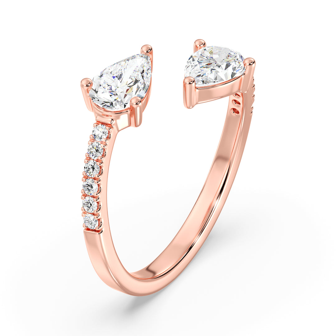 A stunning IGI Certified Pear-Shaped Lab-Grown Diamond Open Cuff Ring in 18K rose gold, showcasing two pear-cut diamonds and round brilliant-cut accent diamonds, blending elegance with modern charm.