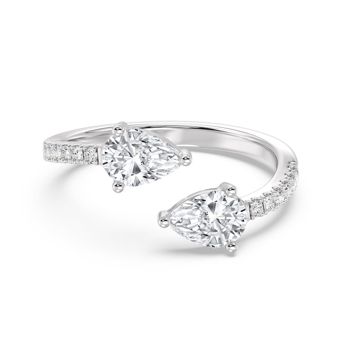 An elegant IGI Certified Pear-Shaped Lab-Grown Diamond Open Cuff Ring in 18K white gold, adorned with two pear-cut diamonds and round brilliant-cut accent diamonds, exuding timeless sophistication and brilliance.