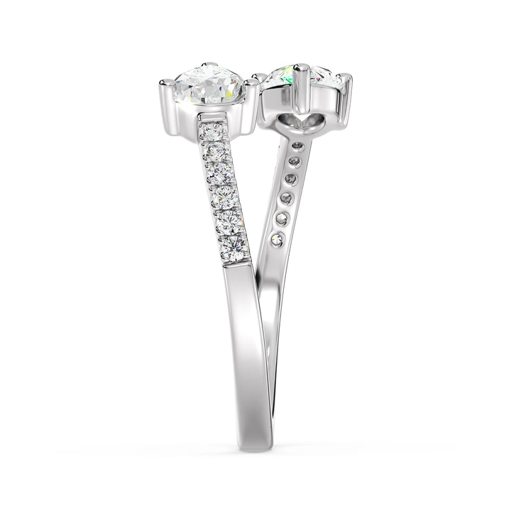 An elegant IGI Certified Pear-Shaped Lab-Grown Diamond Open Cuff Ring in 18K white gold, adorned with two pear-cut diamonds and round brilliant-cut accent diamonds, exuding timeless sophistication and brilliance.