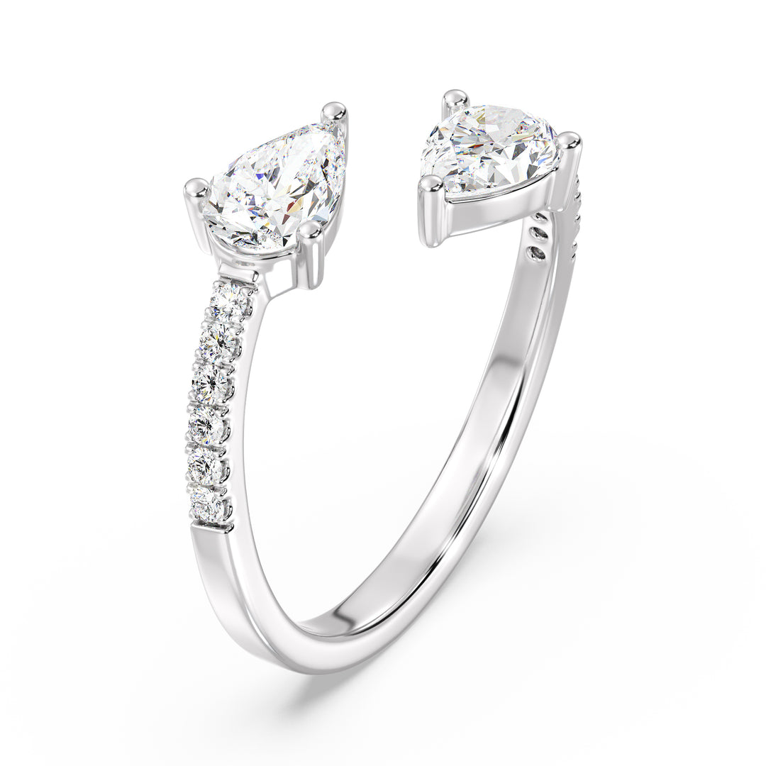An elegant IGI Certified Pear-Shaped Lab-Grown Diamond Open Cuff Ring in 18K white gold, adorned with two pear-cut diamonds and round brilliant-cut accent diamonds, exuding timeless sophistication and brilliance.