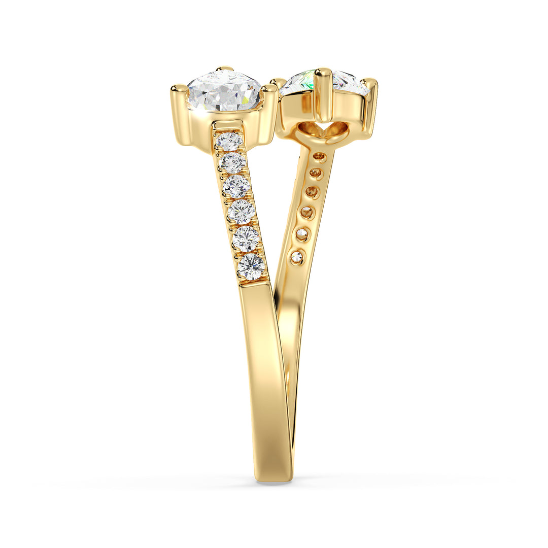 A beautifully crafted IGI Certified Pear-Shaped Lab-Grown Diamond Open Cuff Ring in 18K yellow gold, featuring two pear-cut diamonds and round brilliant-cut accent diamonds for a luxurious and sophisticated look.