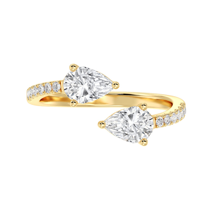 A beautifully crafted IGI Certified Pear-Shaped Lab-Grown Diamond Open Cuff Ring in 18K yellow gold, featuring two pear-cut diamonds and round brilliant-cut accent diamonds for a luxurious and sophisticated look.