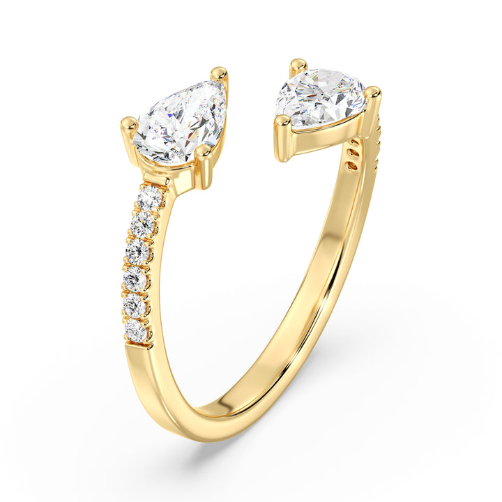 A beautifully crafted IGI Certified Pear-Shaped Lab-Grown Diamond Open Cuff Ring in 18K yellow gold, featuring two pear-cut diamonds and round brilliant-cut accent diamonds for a luxurious and sophisticated look.