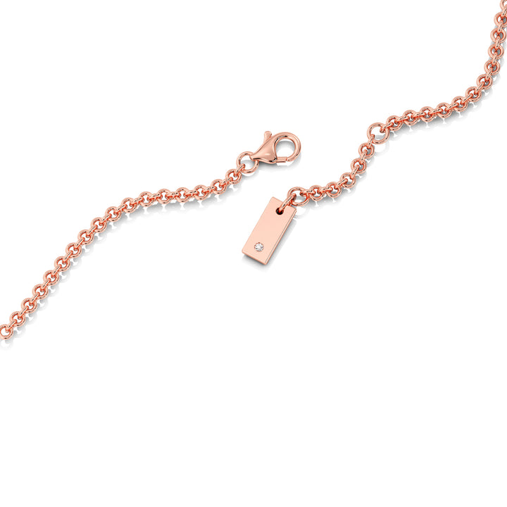 Elegant Emerald-Cut Lab-Grown Diamond Station Necklace in 18K Rose Gold showcasing a bezel-set 1.00-carat emerald-cut diamond with halo and stationed round diamonds for added brilliance.