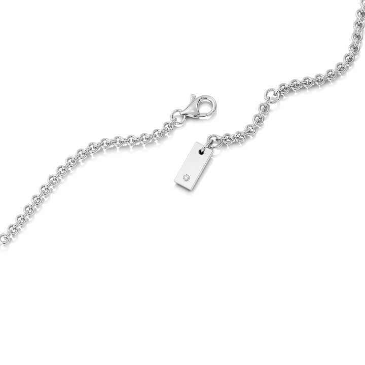 Elegant Emerald-Cut Lab-Grown Diamond Station Necklace in 18K White Gold with a bezel-set 1.00-carat emerald-cut diamond, complemented by a halo and stationed round diamonds