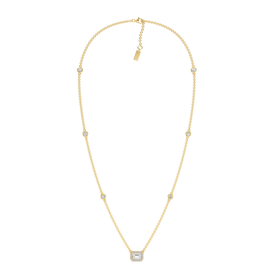 Elegant Emerald-Cut Lab-Grown Diamond Station Necklace in 18K Yellow Gold featuring a bezel-set 1.00-carat emerald-cut diamond with halo and stationed round diamonds along the chain.