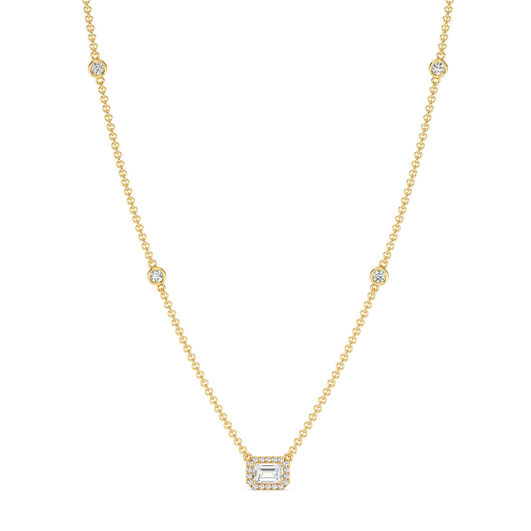 Elegant Emerald-Cut Lab-Grown Diamond Station Necklace in 18K Yellow Gold featuring a bezel-set 1.00-carat emerald-cut diamond with halo and stationed round diamonds along the chain.